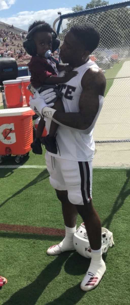 Marcus Murphy holds his son, Mason. (Photo submitted by Alicia Cherry)